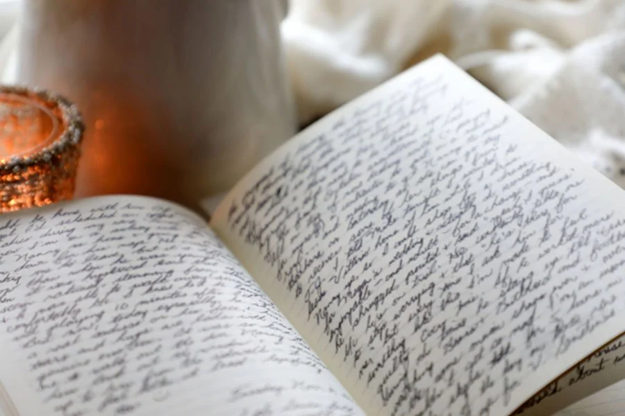 An open notebook with a person's experiences written down.
