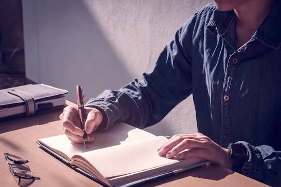 Writing experiences down on paper.