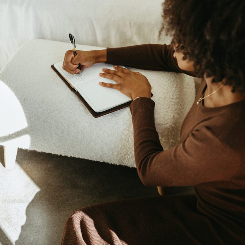 Writing from experience into a journal.